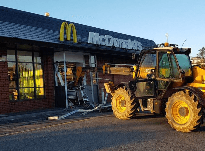 JCB smashes into McDonald’s in failed robbery attempt JCB smashes into McDonald’s in failed robbery attempt