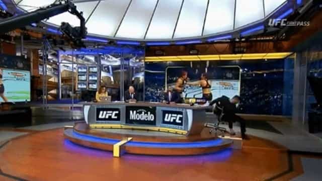 Michael Bisping avoids injury as he falls off chair while covering UFC Liverpool Michael Bisping avoids injury as he falls off chair while covering UFC Liverpool