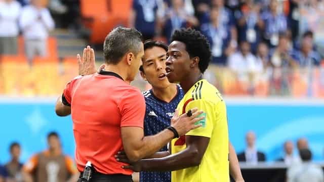 Colombia player sent off for comical attempt to stop a shot with his arm Colombia player sent off for comical attempt to stop a shot with his arm