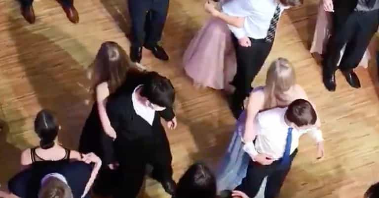Teens dance back-to-back at prom to maintain social distancing Teens dance back-to-back at prom to maintain social distancing