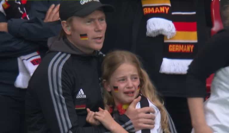 England fans heard cheering when crying German girl was shown on big screen
