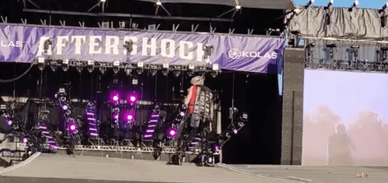 Machine Gun Kelly attacked with bottles and branches on stage at festival Machine Gun Kelly attacked with bottles and branches on stage at festival