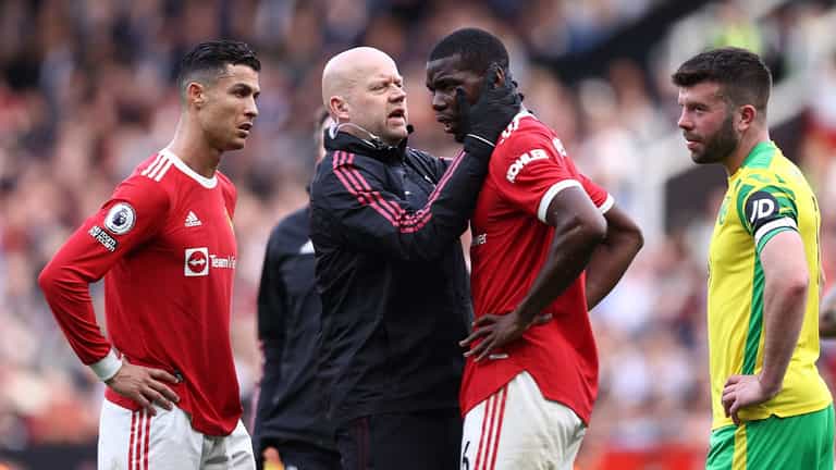 Paul Pogba left needing medical attention after Harry Maguire accidentally kicked him in the head Paul Pogba left needing medical attention after Harry Maguire accidentally kicked him in the head