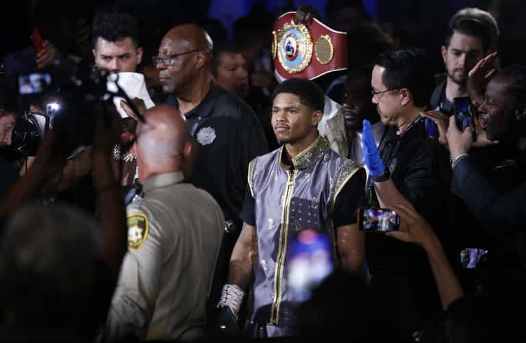 Boxer races off stage to ‘protect mother’ in post-fight brawl