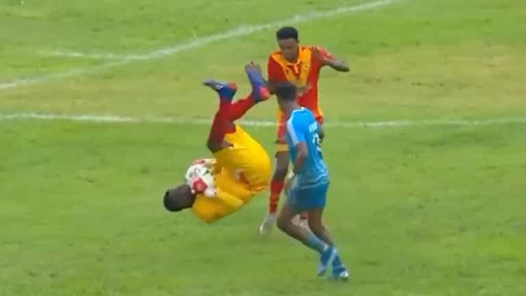 Goalkeeper avoids red card for crazy somersault kick on opponent