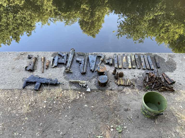 Family finds Uzi machine gun among huge cache of weapons dumped in London river