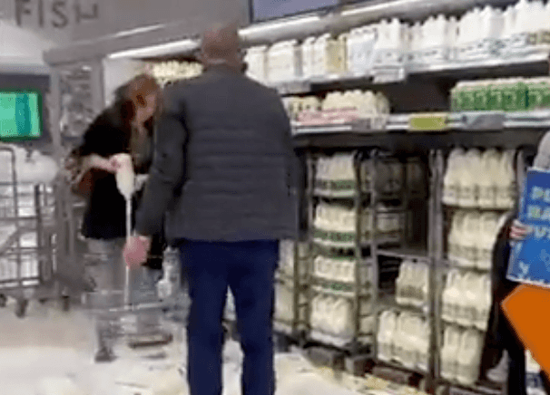 Vegan protesters pour milk onto shop floor in the name of activism Vegan protesters pour milk onto shop floor in the name of activism