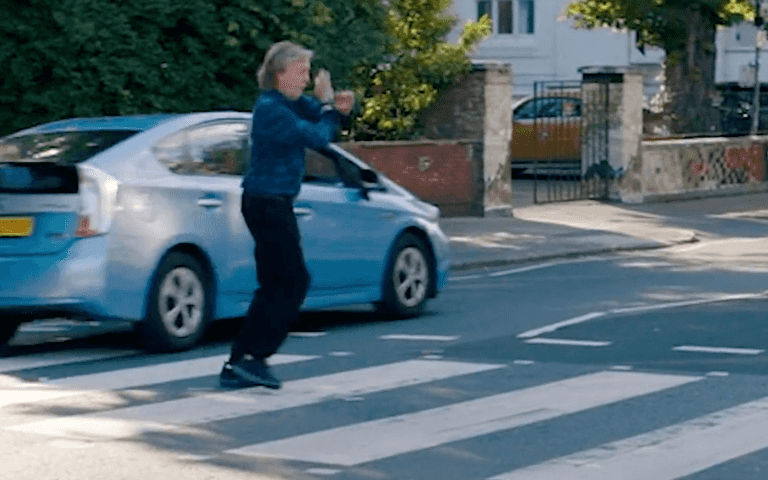 Paul McCartney poses on Abbey Road crossing – car refuses to stop for him