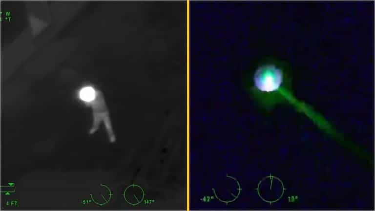 Man shot dead after firing a rifle and pointing laser at police helicopter