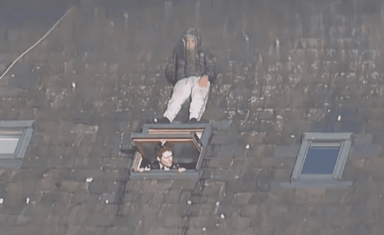 Man trying to avoid police pictured hiding on roof