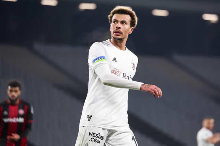Dele Alli pictured surrounded by gas canisters with balloon in his mouth