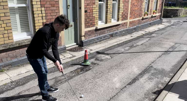 Teenager has so many potholes on road that he turns it into crazy golf course