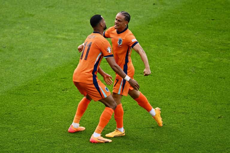 Why do the Netherlands play in orange despite the colour not featuring on their flag?