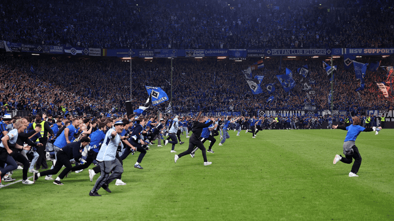 Huge pitch invasion sees 25 fans rushed to hospital Huge pitch invasion sees 25 fans rushed to hospital
