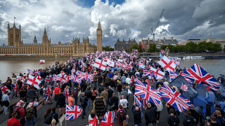 At least 25 arrests made after police officers attacked during Tommy Robinson rally