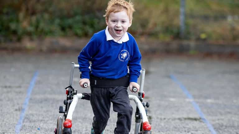 Four-year-old boy with cerebral palsy raises £1,000 for his school by running 100 miles