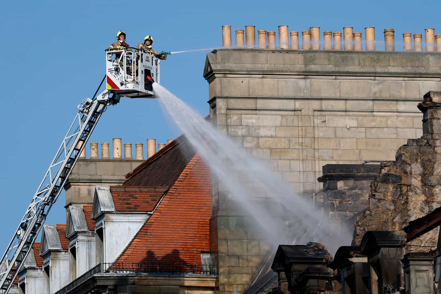 Fire rages through historic building in UK city centre