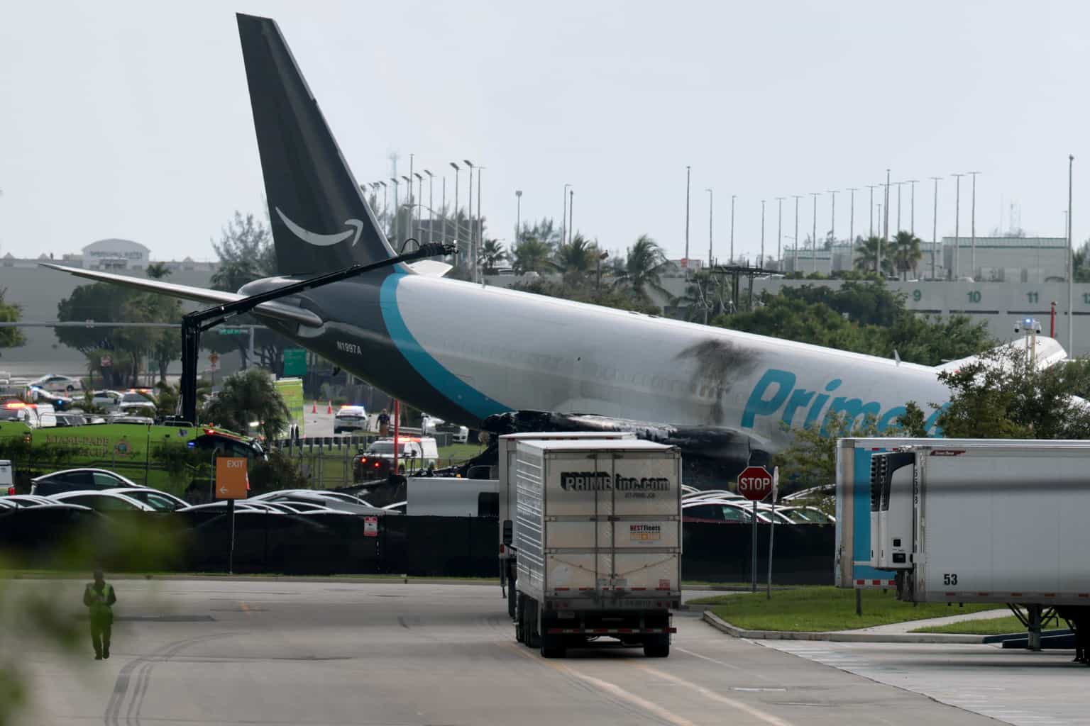 Major US airport shut down after Amazon cargo plane overshoots runway hitting multiple vehicles