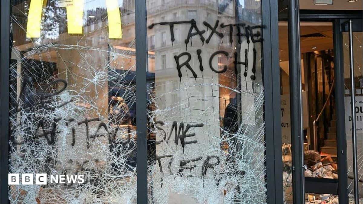 Paris riots leave cars torched and shops looted across France