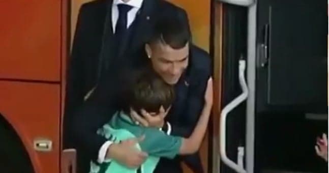 Young fan moved to tears after slipping by security and hugging Cristiano Ronaldo