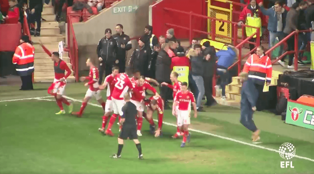 Charlton fan crunches own player during wild goal celebrations