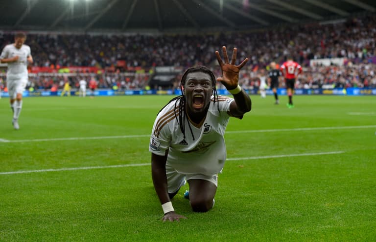 Bafétimbi Gomis scares ball boy with celebration, apologises by giving him his shirt Bafétimbi Gomis scares ball boy with celebration, apologises by giving him his shirt