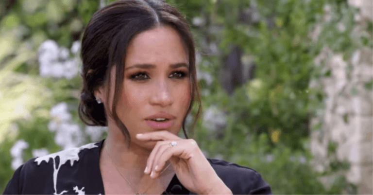 Charlie Hebdo cover sparks outrage after depicting Queen kneeling on Meghan Markle’s neck Charlie Hebdo cover sparks outrage after depicting Queen kneeling on Meghan Markle’s neck