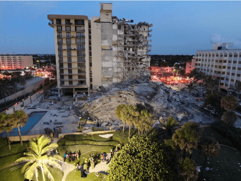 At least one dead after twelve-story apartment building collapses in Miami At least one dead after twelve-story apartment building collapses in Miami