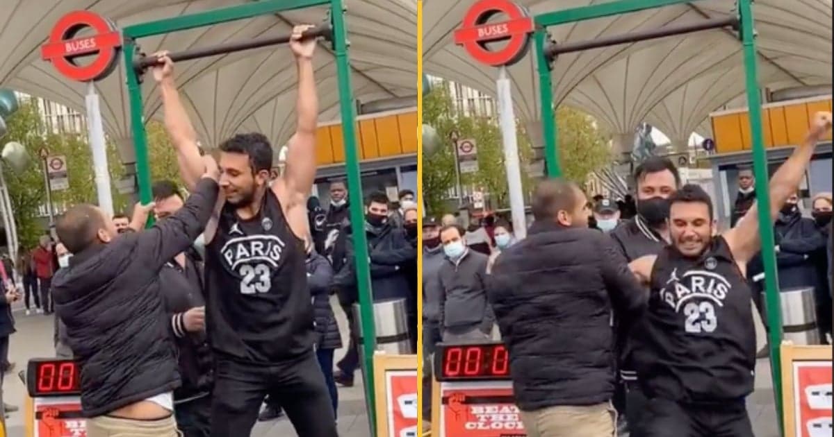 Stall owner pulls man down from hanging bar just as he’s about to win £100