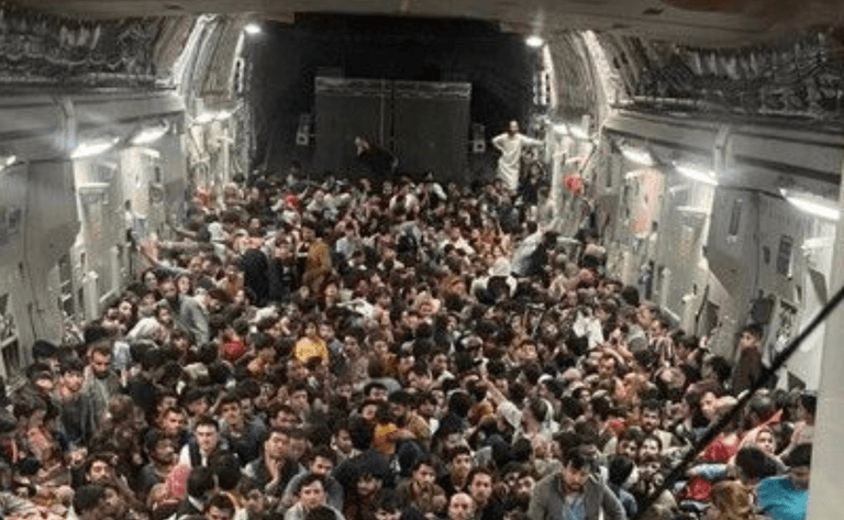 Photos show 640 Afghans crammed into fleeing US Air Force plane Photos show 640 Afghans crammed into fleeing US Air Force plane