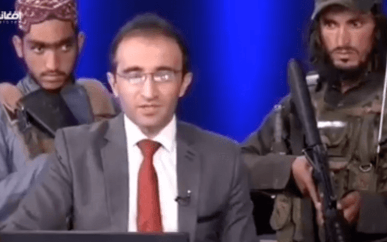 Shocking footage shows reporter read the news surrounded by armed Taliban Shocking footage shows reporter read the news surrounded by armed Taliban