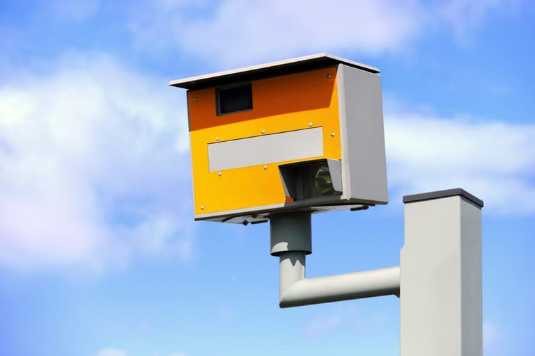 Man filmed climbing into speed camera and flashing drivers with phone Man filmed climbing into speed camera and flashing drivers with phone