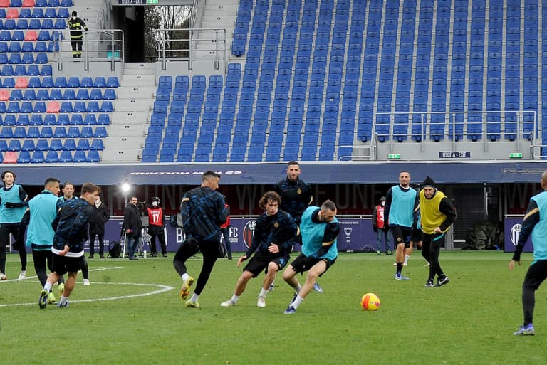 Inter Milan players warm-up for match at Bologna, despite the match being postponed Inter Milan players warm-up for match at Bologna, despite the match being postponed