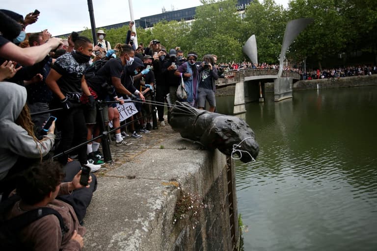 Black Lives Matter protesters cleared over toppling monument of slave trader Edward Colston Black Lives Matter protesters cleared over toppling monument of slave trader Edward Colston