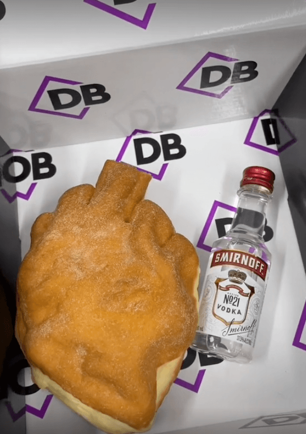 Bakery sends Amber Heard a severed finger cake and vodka bottle – and it does not go down well