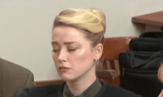 Amber Heard appears ‘distraught’ as court hears explicit Johnny Depp text message