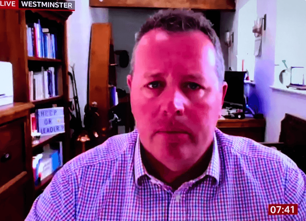 Tory leader in shambolic BBC interview saved by even more embarrassing sign on his bookshelf