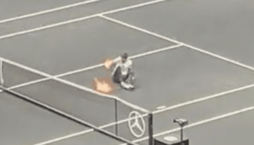 Protestor sets arm on fire after invading tennis court during Laver Cup