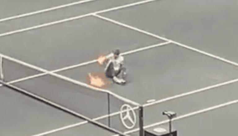 Protestor sets arm on fire after invading tennis court during Laver Cup Protestor sets arm on fire after invading tennis court during Laver Cup