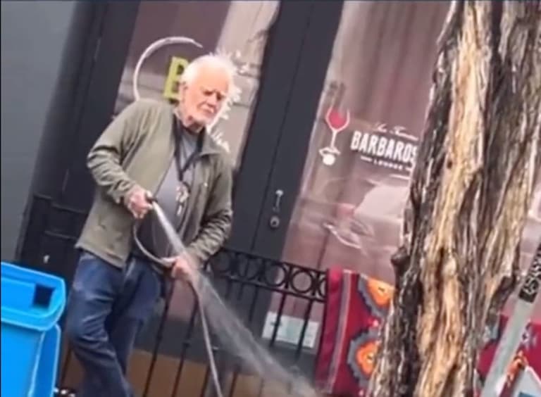 Gallery owner arrested after he was filmed spraying homeless woman with hose Gallery owner arrested after he was filmed spraying homeless woman with hose