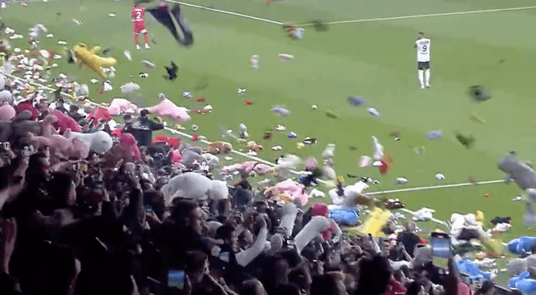 Besiktas and Antalyaspor fans throw stuffed toys onto pitch for earthquake victims Besiktas and Antalyaspor fans throw stuffed toys onto pitch for earthquake victims