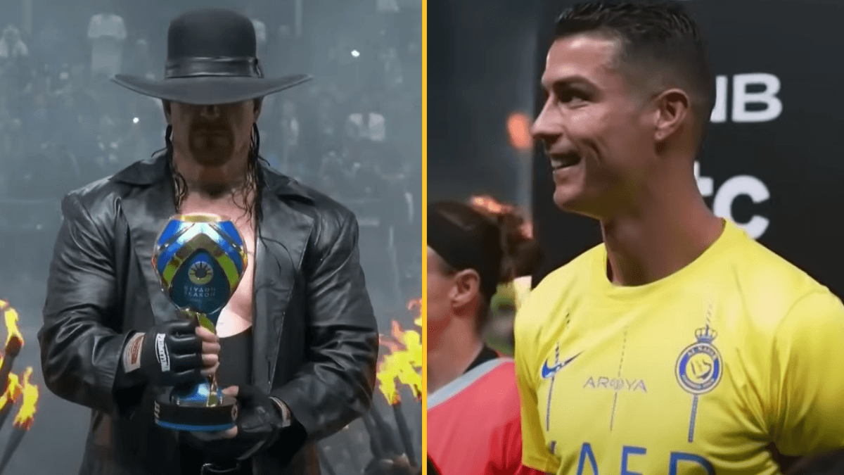 The Undertaker presents the Riyadh Season trophy for the game between Al-Nassr and Al-Hilal