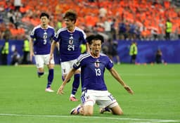 Why do Japan play in blue despite the colour not featuring on their flag