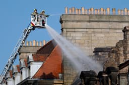 Fire rages through historic building in UK city centre