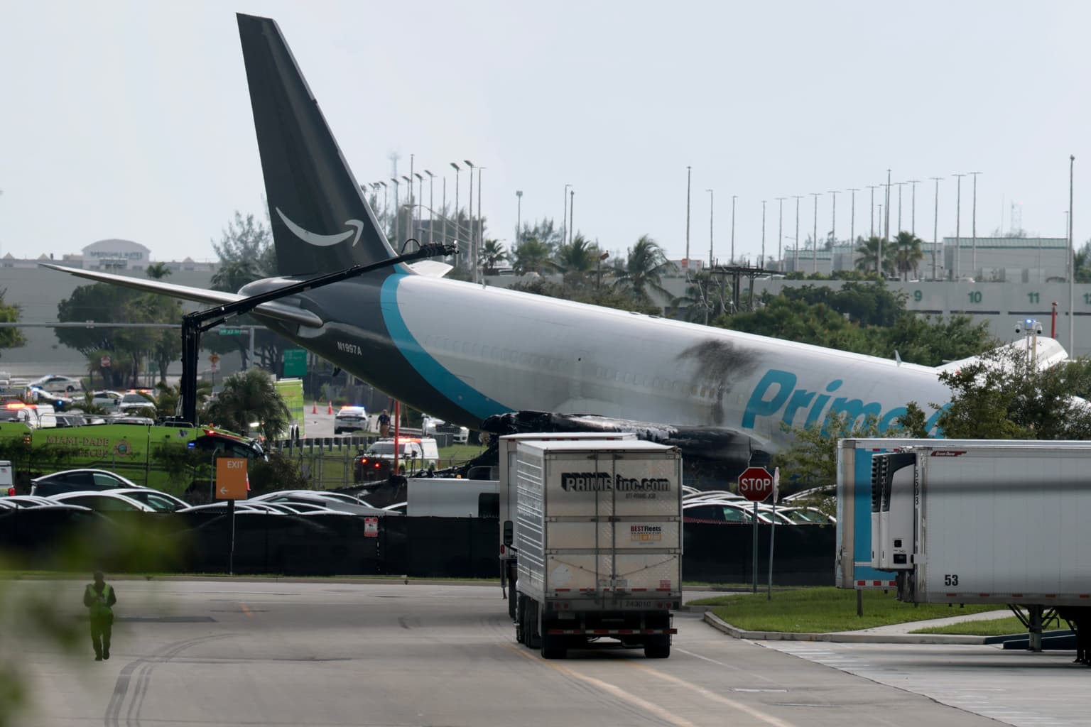 Major US airport shut down after Amazon cargo plane overshoots runway hitting multiple vehicles