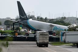 Major US airport closed after Amazon cargo plane overshoots runway hitting multiple vehicles