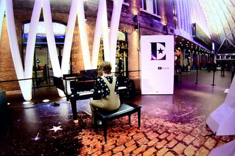 Elton John entertained commuters at King’s Cross this morning Elton John entertained commuters at King’s Cross this morning
