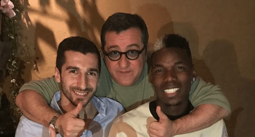 Henrikh Mkhitaryan celebrates with Paul Pogba and Mino Raiola as Alexis Sanchez swap deal nears