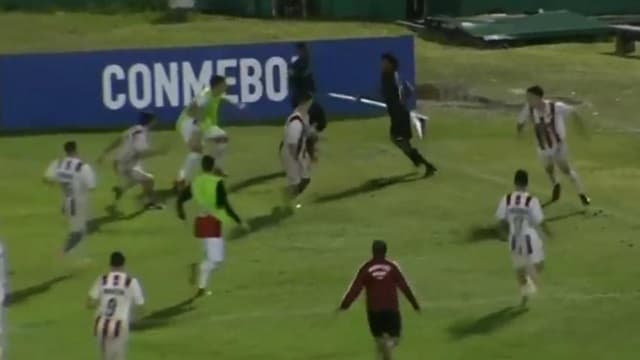 Ecuador player treats corner flag like a spear to avoid being attacked Ecuador player treats corner flag like a spear to avoid being attacked