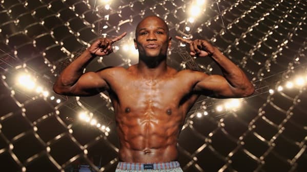 UFC welterweight champion will train Floyd Mayweather in mixed martial arts